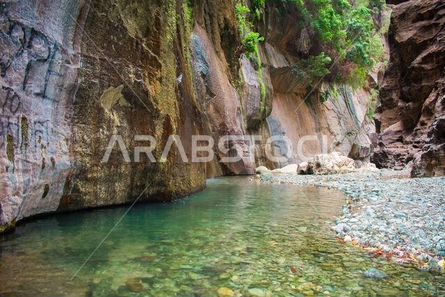 Rocky peaks and heights, rock formations in Wadi Al-Jub in the Kingdom of Saudi Arabia landscapes of the water stream in Jizan