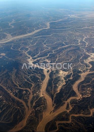 A Surreal aerial view of dried riverbeds in the desert in Jordan near the border with Saudi Arabia.