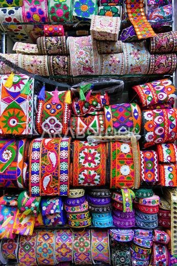 Colourful ethnic embroidered fringing in a haberdasher's shop in Jeddah, Saudi Arabia