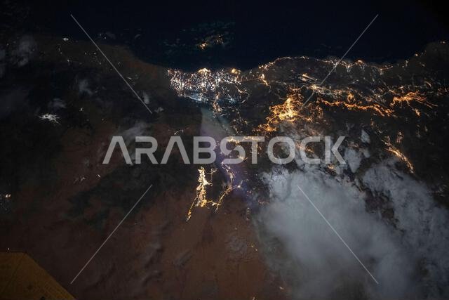 The city lights of Jazan (top center) and its suburbs on the Red Sea coast of Saudi Arabia.
