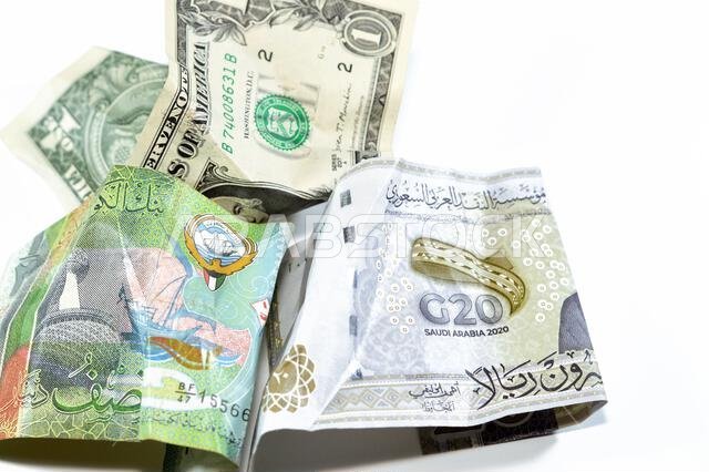 Wrinkled, crumpled Saudi Arabia, Kuwaiti half dinar money 20 SAR twenty riyals, 1 one American dollar cash, Money inflation and losing value, drop con