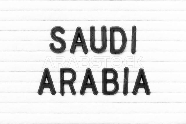 Black color letter in word saudi arabia on white felt board background