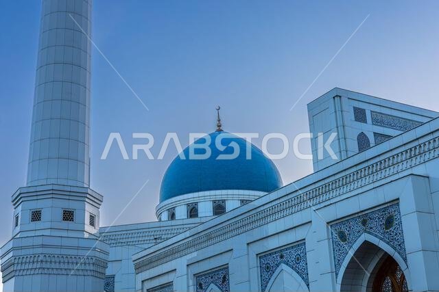 Muslim mosque with white trim and blue dome