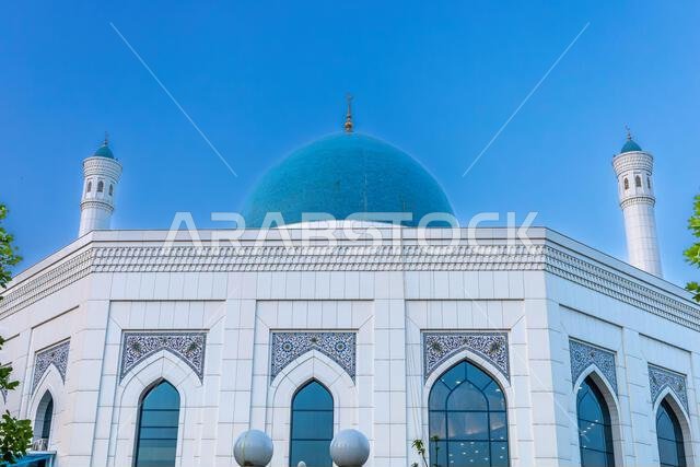 Muslim mosque with white trim and blue dome