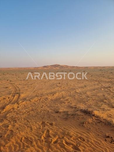 A closeup of a beautiful landscape of a desert on a sunny, hot day in Saudi Arabia