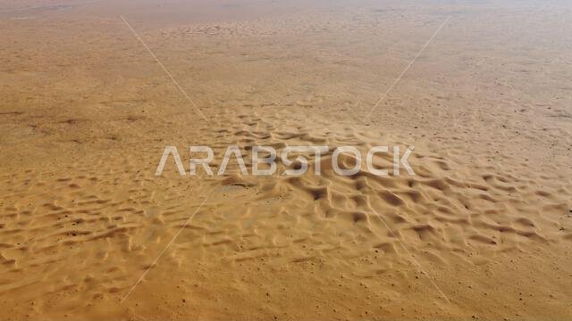 A closeup of a beautiful landscape of a desert on a sunny, hot day in Saudi Arabia