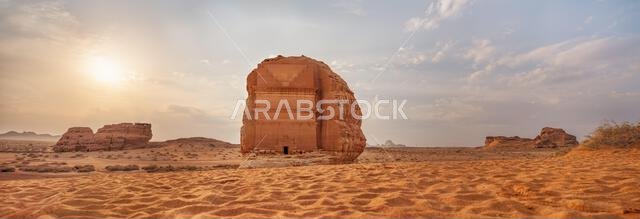 Tomb Lihyan Son of Kuza or Qasr al-Farid at Hegra, Saudia Arabia - most popular landmark in Mada'in Salih archaeological site, sandy desert landscape