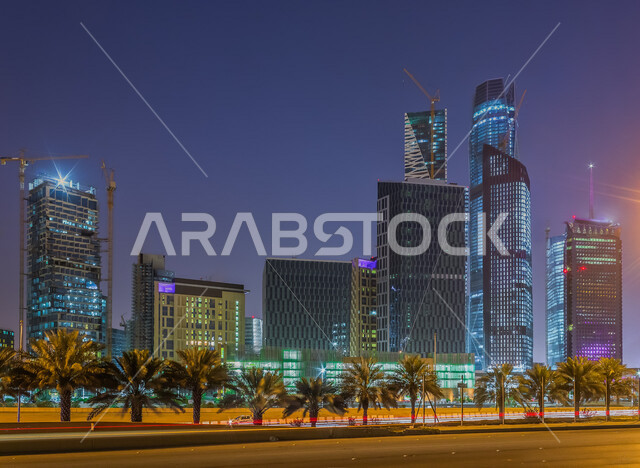 Creative image of King Abdullah Financial Center (KAFD) in Riyadh, Saudi Arabia at night, famous Riyadh landmarks, towers and skyscrapers, architecture in Saudi Arabia, tourism in Saudi Arabia
