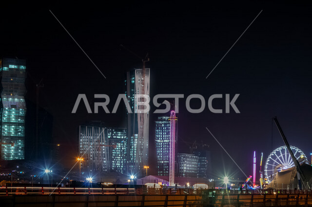 صورة ابداعية لمركز الملك عبدالله المالي ( كافد ) في الرياض بالمملكة العربية السعودية ليلا، معالم الرياض المشهورة، ابراج وناطحات سحاب، الفن الهندسي المعماري بالسعودية، السياحة في السعودية