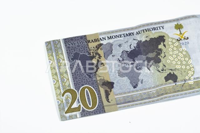 Reverse side of 20 SAR twenty Saudi Arabia Riyals banknote currency bill money Commemorative issue with a map of the world depicting G20 summit countr