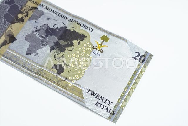 Reverse side of 20 SAR twenty Saudi Arabia Riyals banknote currency bill money Commemorative issue with a map of the world depicting G20 summit countr