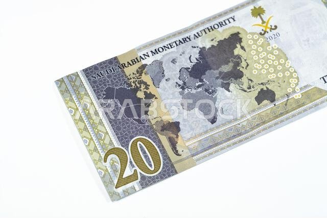 Reverse side of 20 SAR twenty Saudi Arabia Riyals banknote currency bill money Commemorative issue with a map of the world depicting G20 summit countr