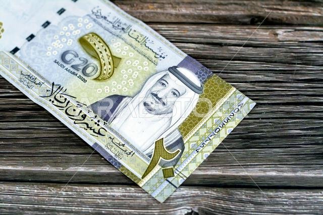 Obverse side of 20 SAR twenty Saudi Arabia Riyals banknote currency bill money Commemorative issue with portrait of king Salman , 3D logo of the Kingd