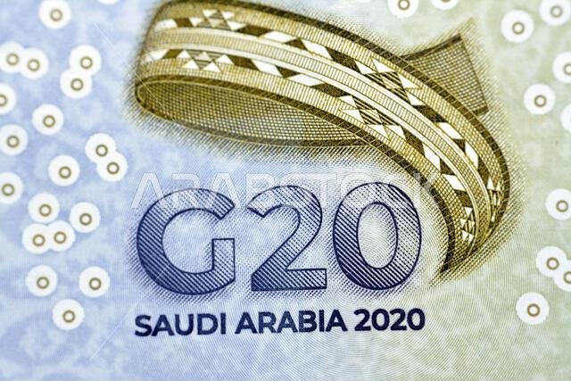 3D logo of the Kingdom's Presidency of G20 summit in 2020 AD 1442 AH from Obverse side of 20 SAR twenty Saudi Arabia Riyals banknote currency bill mon
