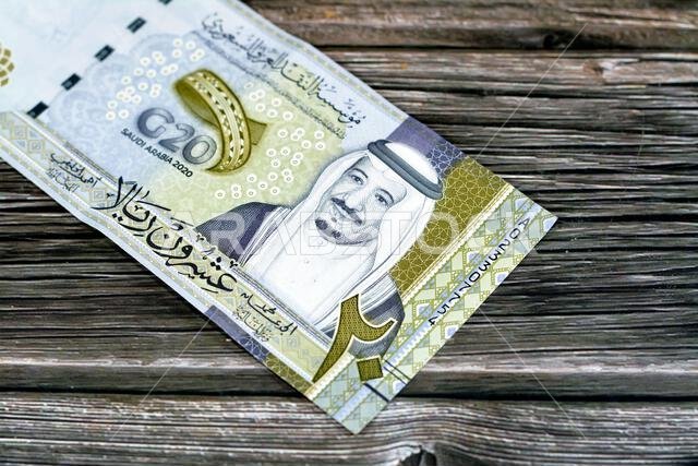 Obverse side of 20 SAR twenty Saudi Arabia Riyals banknote currency bill money Commemorative issue with portrait of king Salman , 3D logo of the Kingd
