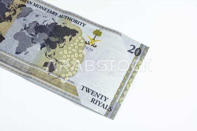 Reverse side of 20 SAR twenty Saudi Arabia Riyals banknote currency bill money Commemorative issue with a map of the world depicting G20 summit countr