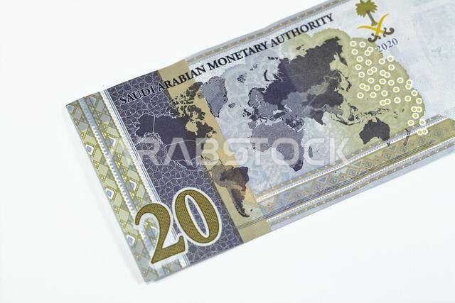 Reverse side of 20 SAR twenty Saudi Arabia Riyals banknote currency bill money Commemorative issue with a map of the world depicting G20 summit countr