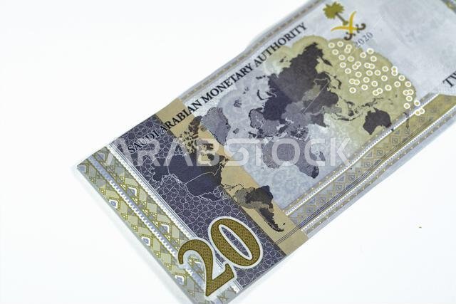 Reverse side of 20 SAR twenty Saudi Arabia Riyals banknote currency bill money Commemorative issue with a map of the world depicting G20 summit countr