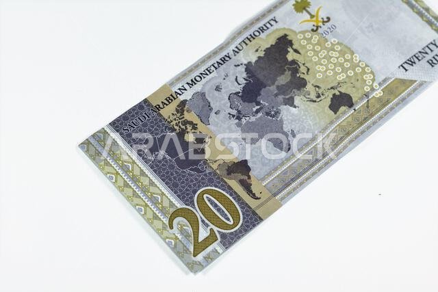 Reverse side of 20 SAR twenty Saudi Arabia Riyals banknote currency bill money Commemorative issue with a map of the world depicting G20 summit countr