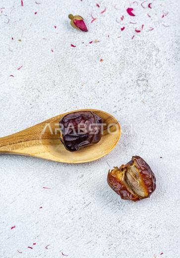 Raw Organic Arabic Dates, Ajwa Dates on light gray background. Ramadan Kareem. Top View.