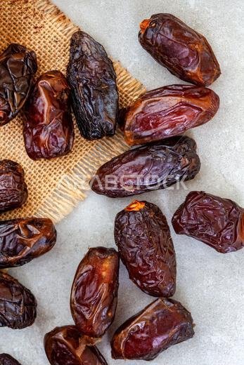 Dried dates on rustic grey surface