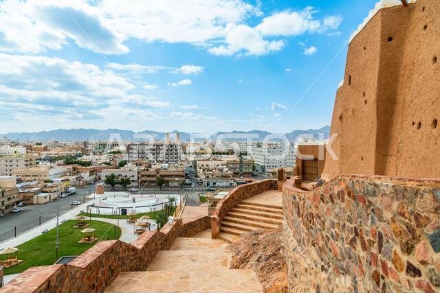 Hail city downtown and walls of Arabian Aarif fortress standing on the hill, Hail, Saudi Arabia Hail city downtown and walls of Arabian Aarif fortress standing on the hill, Hail, Saudi Arabia