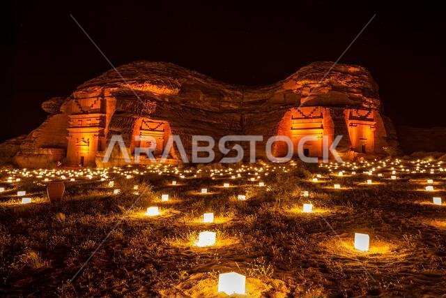 Ancient tombs of Hegra city illuminated during the night, Al Ula, Saudi Arabia