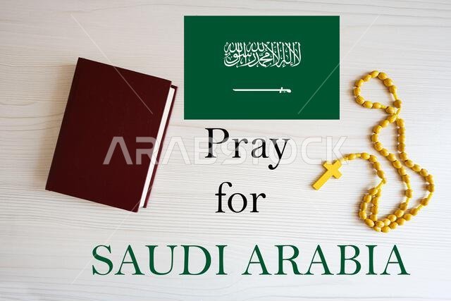 Pray for Saudi Arabia. Rosary and Holy Bible background.