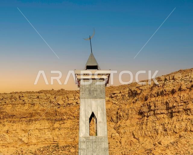 Mosque Minaret against Cliff - Dusk view