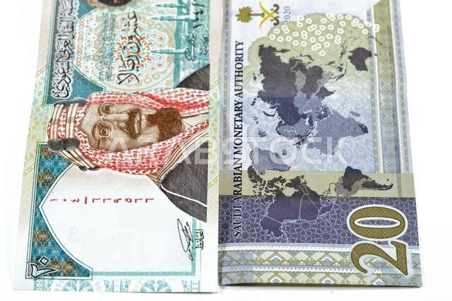 20 SAR twenty Saudi Arabia Riyals banknotes currency bill money an old one with king AbdulAziz photo, Quba Mosque, light mountain and new one with Kin