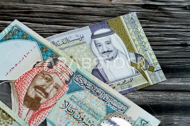 20 SAR twenty Saudi Arabia Riyals banknotes currency bill money an old one with king AbdulAziz photo, Quba Mosque, light mountain and new one with Kin