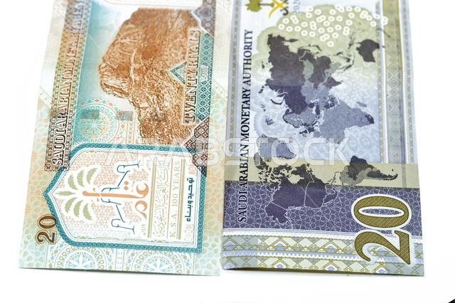 20 SAR twenty Saudi Arabia Riyals banknotes currency bill money an old one with king AbdulAziz photo, Quba Mosque, light mountain and new one with Kin