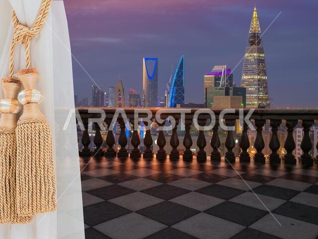 A view of Riyadh city, Saudi Arabia from a terrace (balcony) of a high building from inside the room showing a white beautiful curtains.