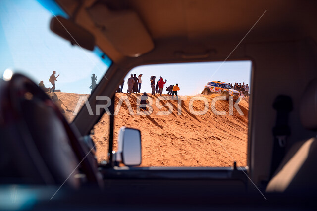 The Dakar Rally race in Saudi Arabia, the World Desert Rally Championship, dirt motorsport, tracks on the dunes, the sport of pedaling on the soft sand in the desert of the Kingdom of Saudi Arabia, recreational activities, car racing