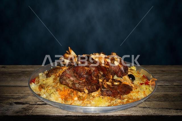 Mandi is a traditional dish from Yemen of meat, rice, and spices. It is now very popular in other areas of the Arabian Peninsula.