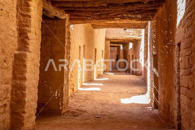 Al Ula old town street between mud bricked walls , Saudi Arabia