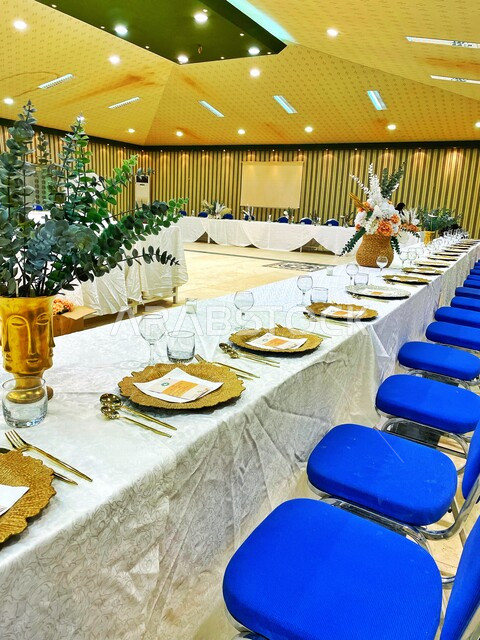 A picture inside a conference room, a banquet hall, and a dinner banquet.
