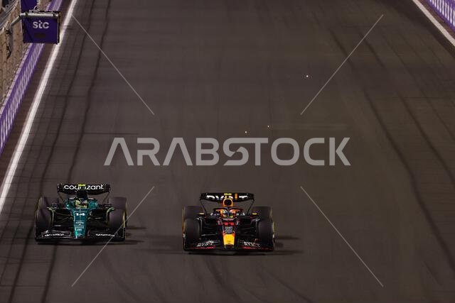 Jeddah, Saudi Arabia. 19th Mar, 2023. (L to R): Fernando Alonso (ESP) Aston Martin F1 Team AMR23 and Sergio Perez (MEX) Red Bull Racing RB19 battle for the lead of the race. Formula 1 World Championship, Rd 2, Saudi Arabian Grand Prix, Sunday 19th March 2023. Jeddah, Saudi Arabia. Credit: James Moy/Alamy Live News Jeddah, Saudi Arabia. 19th Mar, 2023. (L to R): Fernando Alonso (ESP) Aston Martin F1 Team AMR23 and Sergio Perez (MEX) Red Bull Racing RB19 battle for the lead of the race. Formula 1 World Championship, Rd 2, Saudi Arabian Grand Prix, Sunday 19th March 2023. Jeddah, Saudi Arabia. Credit: James Moy/Alamy Live News