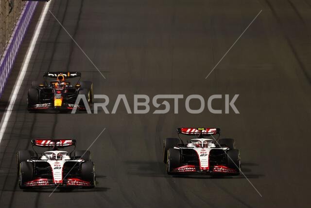Jeddah, Saudi Arabia. 19th Mar, 2023. (L to R): Kevin Magnussen (DEN) Haas VF-23 and Nico Hulkenberg (GER) Haas VF-23 battle for position. Formula 1 World Championship, Rd 2, Saudi Arabian Grand Prix, Sunday 19th March 2023. Jeddah, Saudi Arabia. Credit: James Moy/Alamy Live News