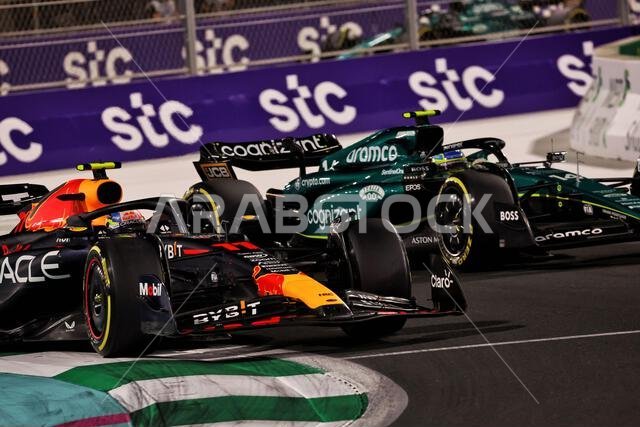 Jeddah, Saudi Arabia. 19th Mar, 2023. Sergio Perez (MEX) Red Bull Racing RB19 and Fernando Alonso (ESP) Aston Martin F1 Team AMR23 battle for the lead of the race. 19.03.2023. Formula 1 World Championship, Rd 2, Saudi Arabian Grand Prix, Jeddah, Saudi Arabia, Race Day. Photo credit should read: XPB/Press Association Images. Credit: XPB Images Ltd/Alamy Live News