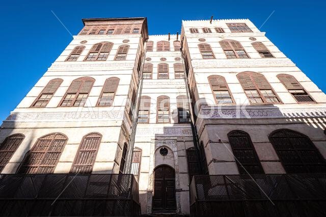 Exterior view of the recently renovated ornate facade of the Nasseef coral townhouse in the historic district Al Balad, Jeddah, KSA, Saudi Arabia