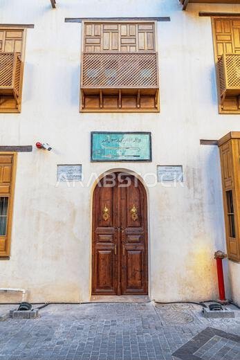 View of the beautiful wooden door with golden decorations of Beit Basurrah in the historic Al-Balad neighborhood in Jeddah, KSA, Saudi Arabia