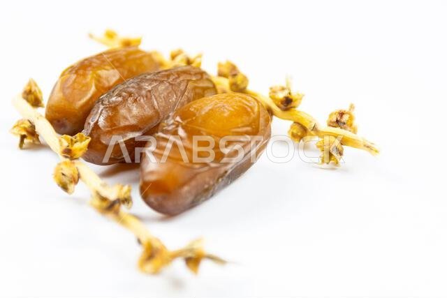 Close-up of Algerian royal dates on a white background. Ramadan concept.