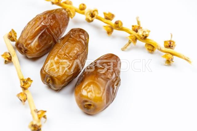 Close-up of Algerian royal dates on a white background. Ramadan concept.