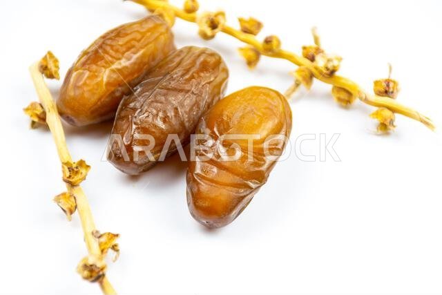 Close-up of Algerian royal dates on a white background. Ramadan concept.
