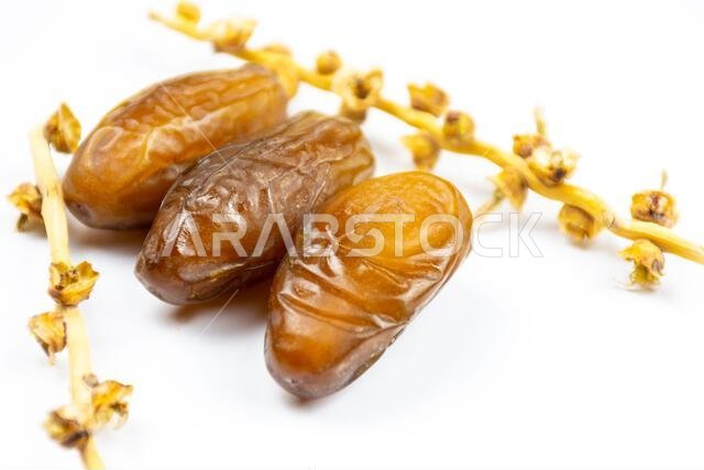 Close-up of Algerian royal dates on a white background. Ramadan concept.