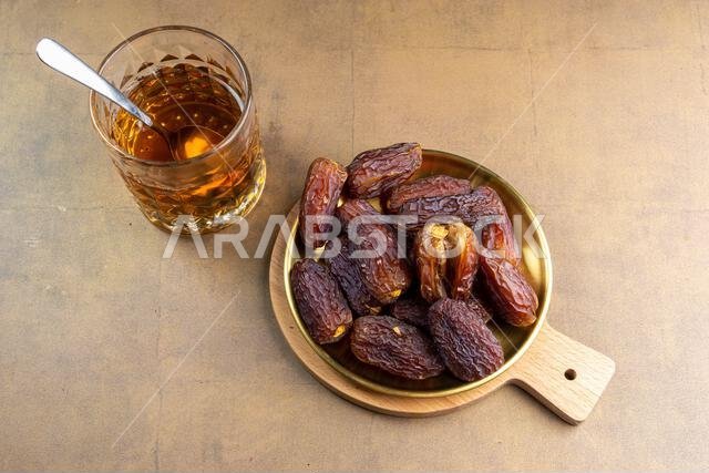 Raw Organic Medjool Dates (Kurma in Indonesia). It's also Ramadan "Iftar". Ramadan Kareem. Close up.