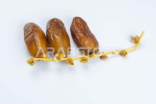 Close-up of Algerian royal dates on a white background. Ramadan concept.