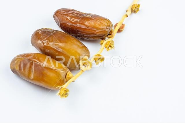 Close-up of Algerian royal dates on a white background. Ramadan concept.