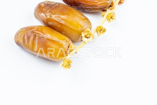 Close-up of Algerian royal dates on a white background. Ramadan concept.